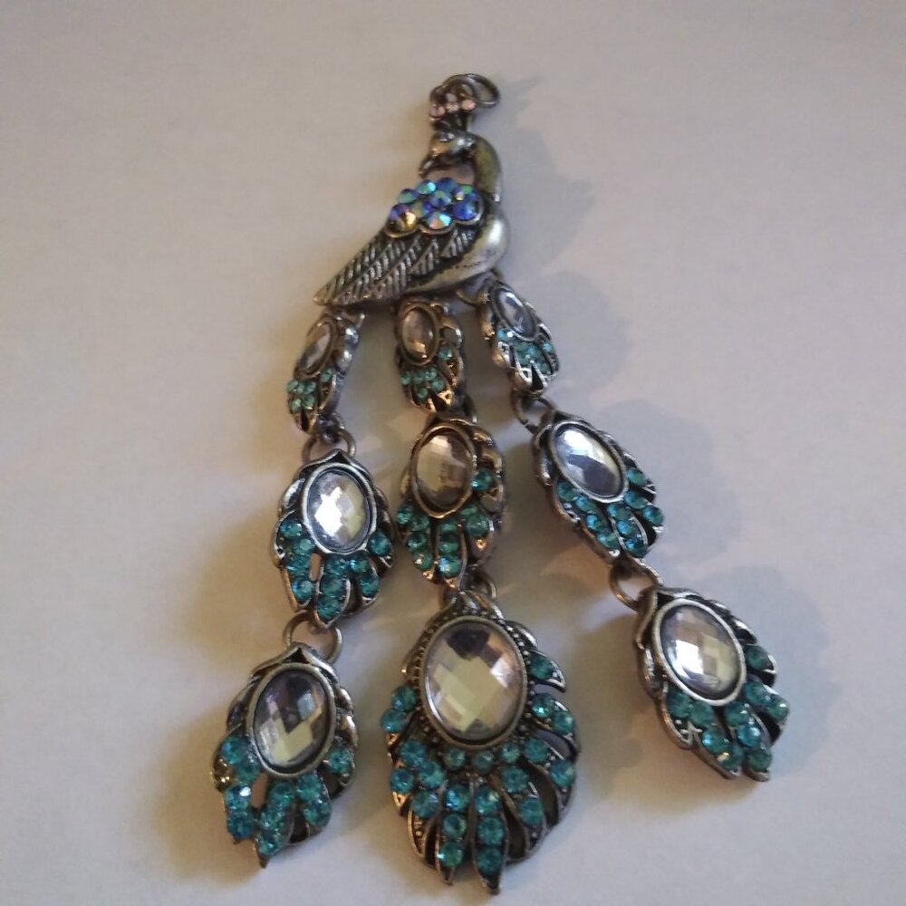 Gorgeous Blue  and Turquoise Colored Jeweled Peacock Pendant.